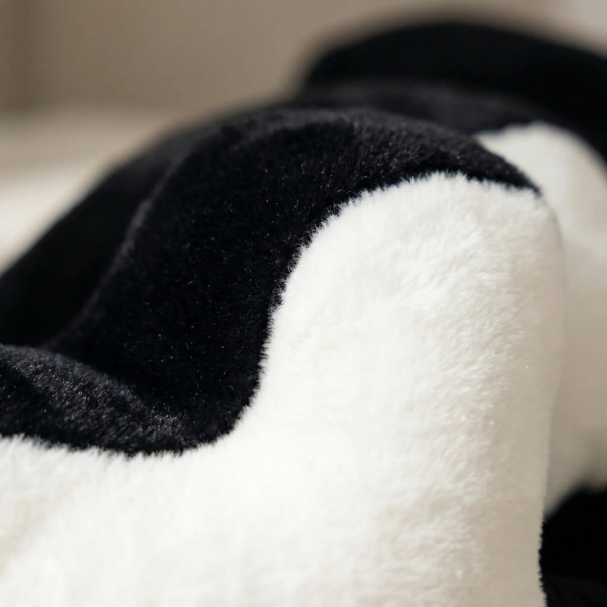 Puzzle-Shaped Cushion in Modern Black and White Design