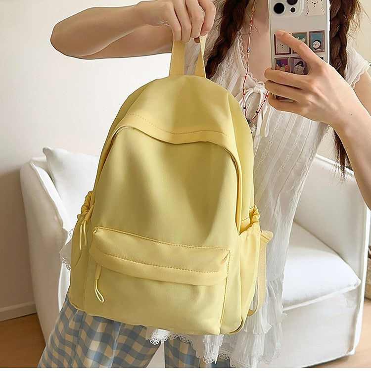 Casual Backpack with Flexible Side Pockets and Organized Compartments
