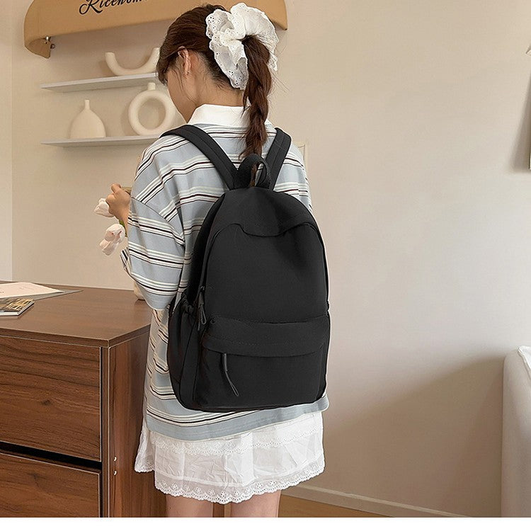 Casual Backpack with Flexible Side Pockets and Organized Compartments