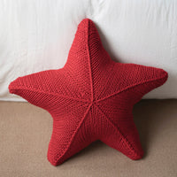 Hand-knitted starfish cushion
