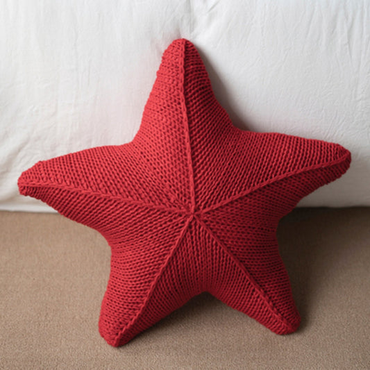 Hand-knitted starfish cushion