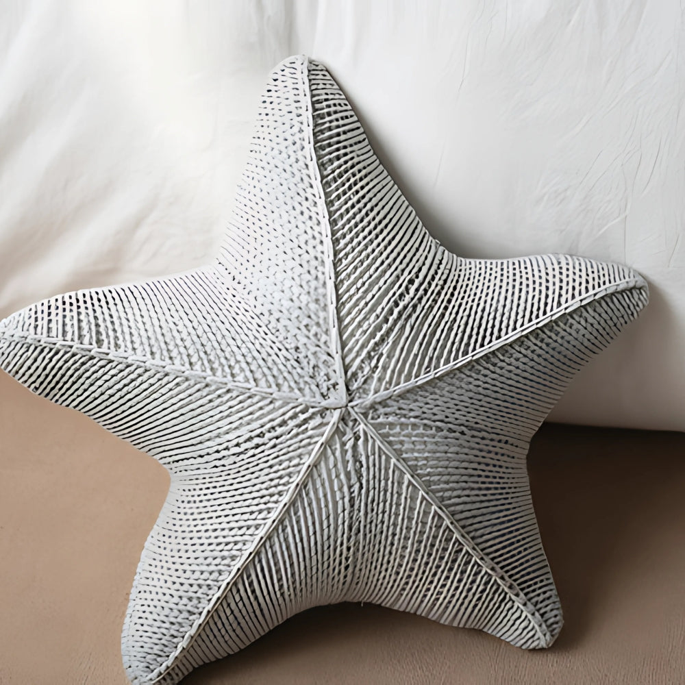 Hand-knitted starfish cushion
