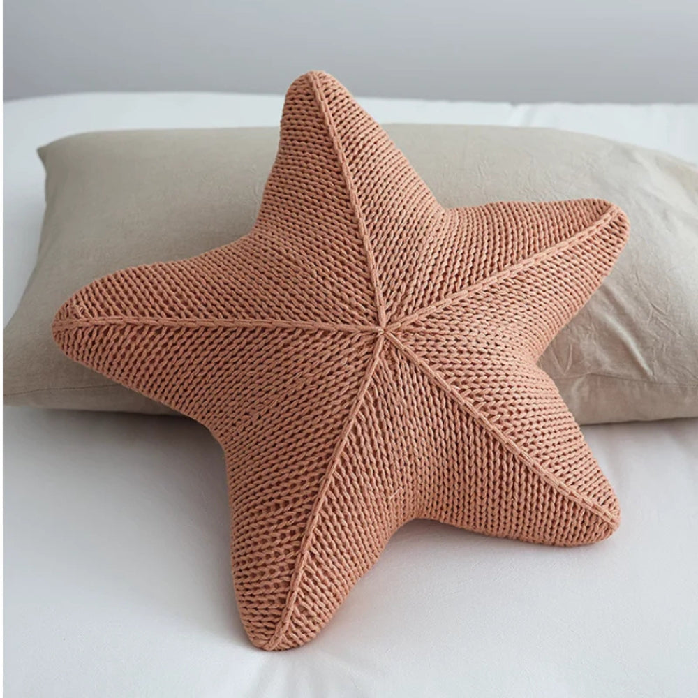 Hand-knitted starfish cushion