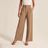 High-waisted pleated linen-feel trousers