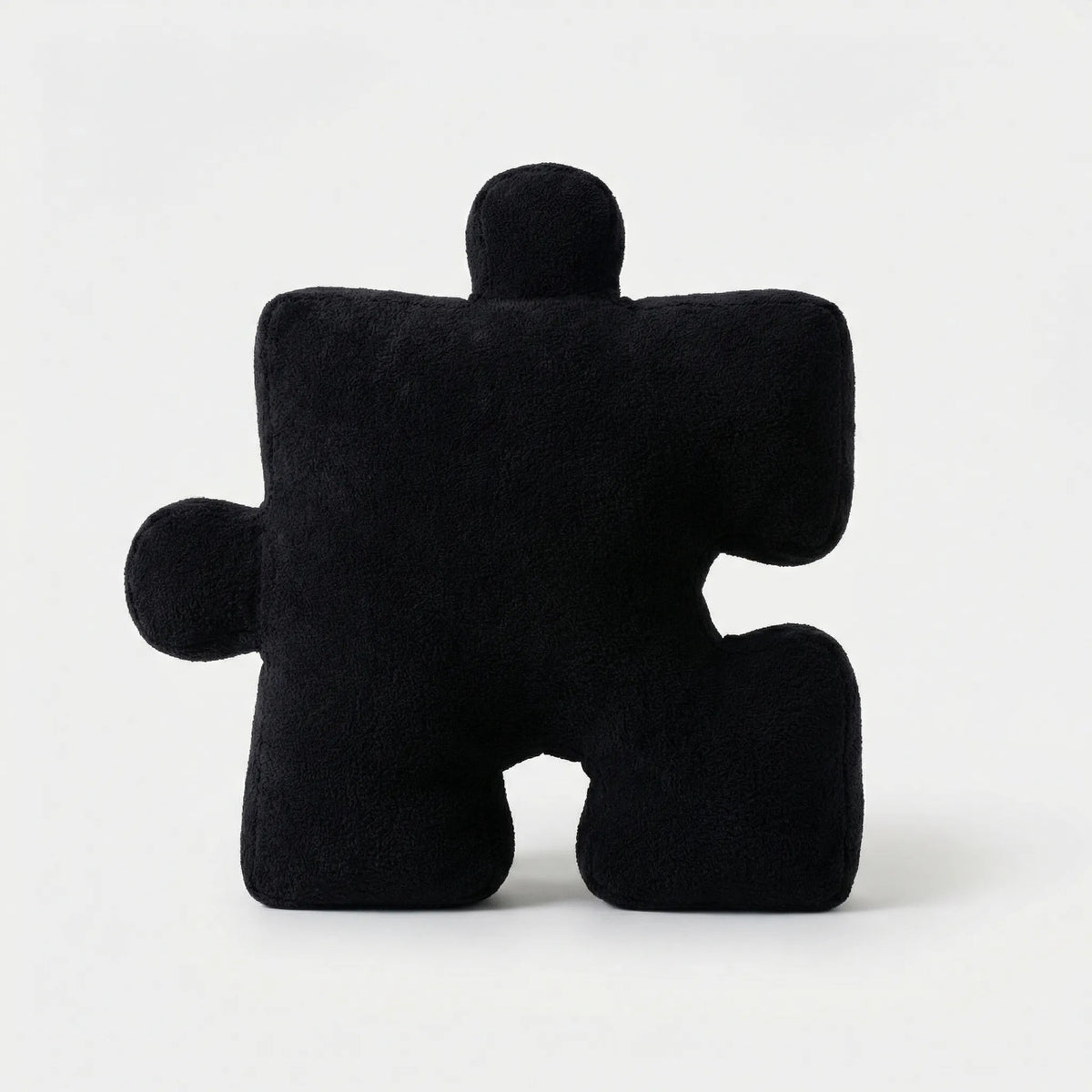 Puzzle-Shaped Cushion in Modern Black and White Design