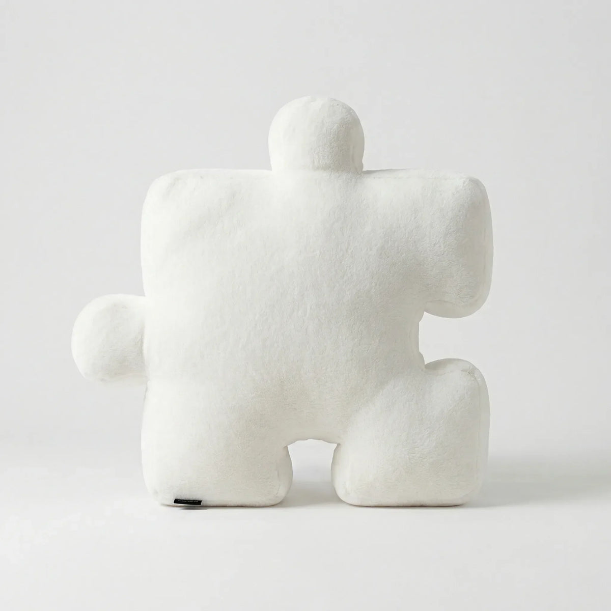 Puzzle-Shaped Cushion in Modern Black and White Design